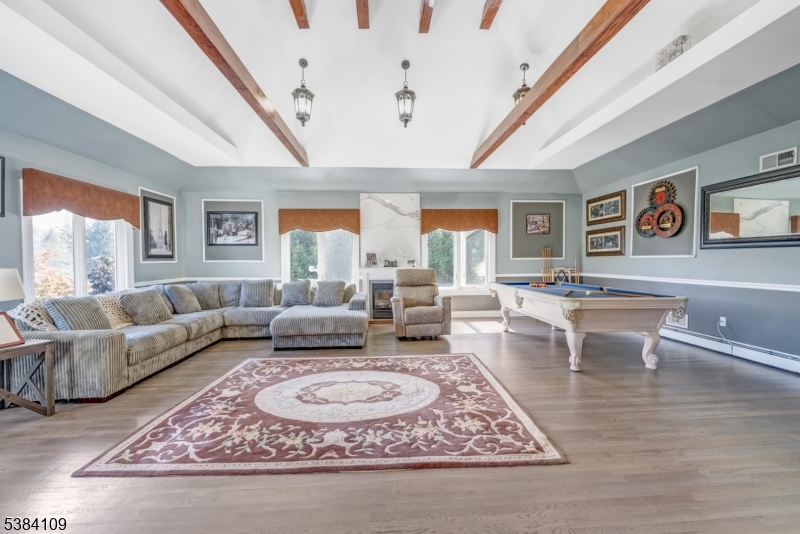 207 Eileen Drive Cedar Grove, NJ 07009 - Photo 5 of 26 a living room with furniture rug and window