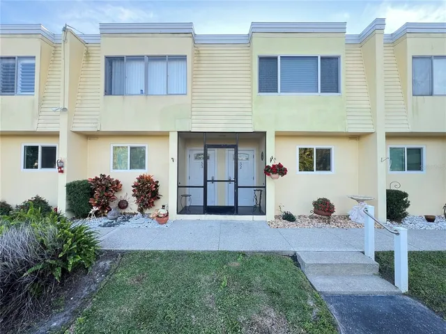 a view of a house with couches in front of house