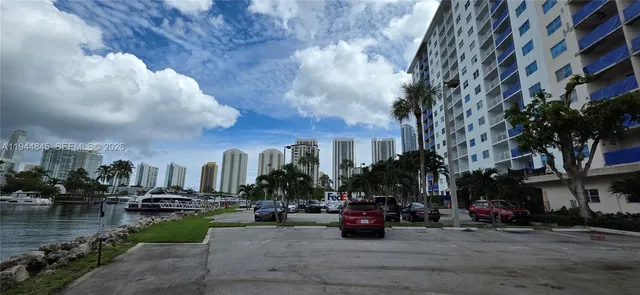 a view of water with building and lake view