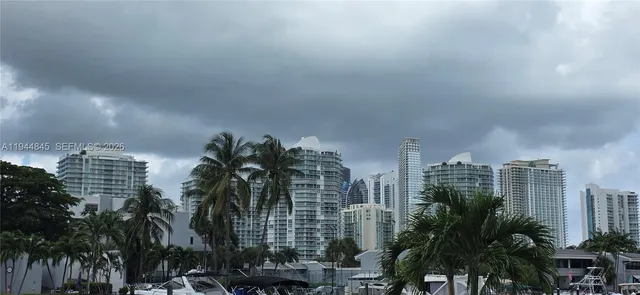 a view of building with yard and trees