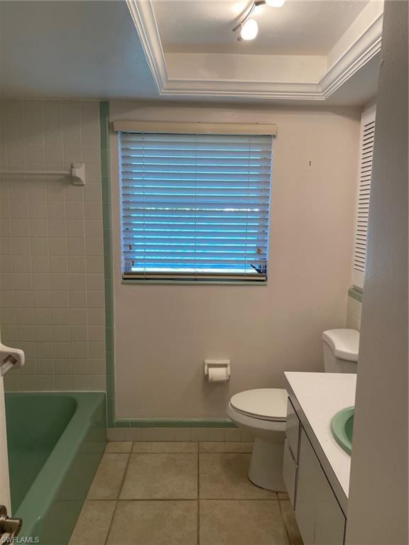 620 Orchid Drive Naples, FL 34102 - Photo 15 of 16 a bathroom with a toilet a sink and mirror