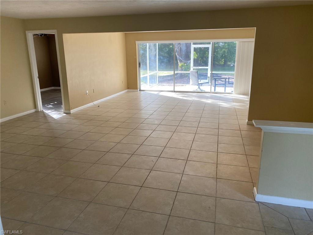 620 Orchid Drive Naples, FL 34102 - Photo 7 of 16 a view of an empty room with a window