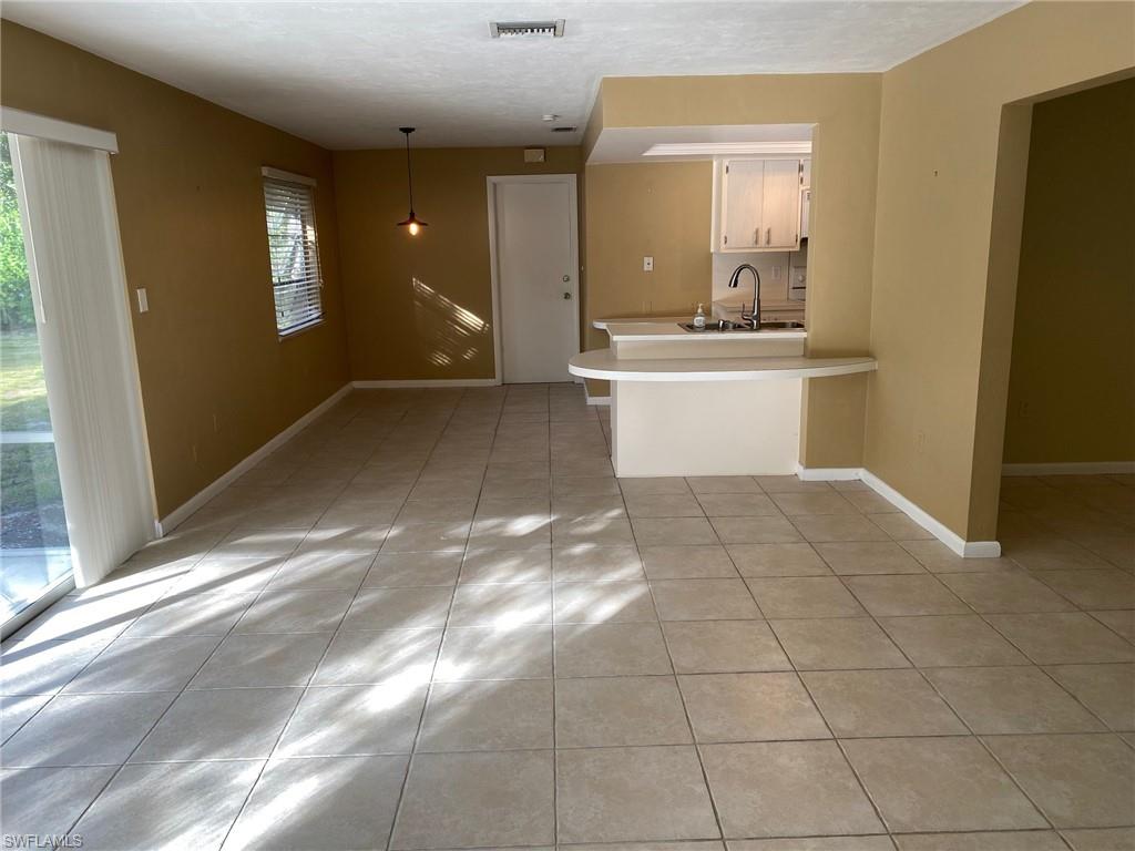620 Orchid Drive Naples, FL 34102 - Photo 9 of 16 a view of a bathroom with a bathtub and a sink