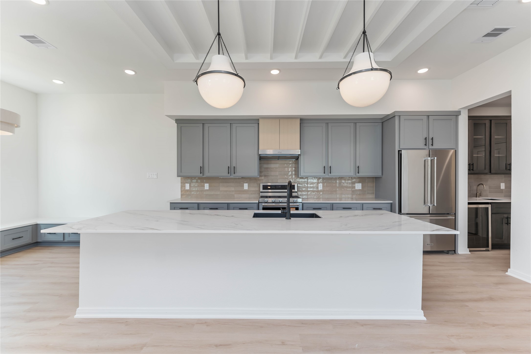 3508 Delhi Street Houston, TX 77022 - Photo 11 of 38 a kitchen with stainless steel appliances a refrigerator a sink and a stove
