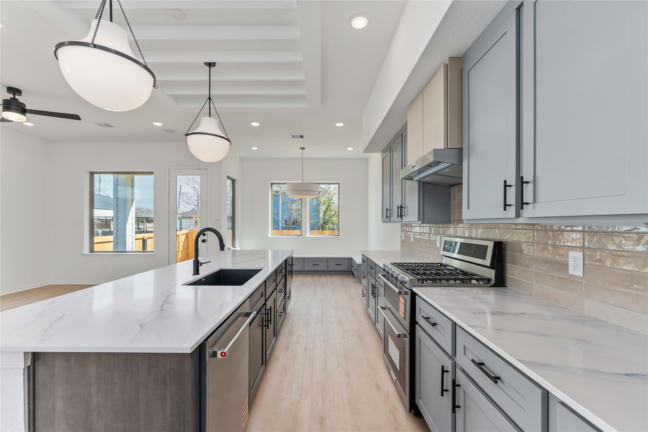 3508 Delhi Street Houston, TX 77022 - Photo 13 of 38 a kitchen with stainless steel appliances granite countertop a sink a stove and a wooden floors