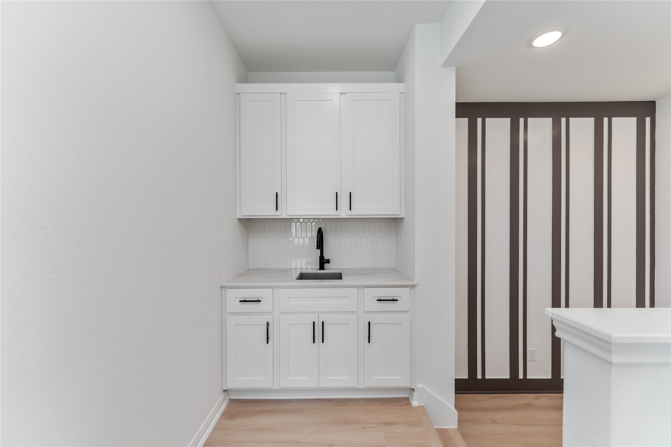 3508 Delhi Street Houston, TX 77022 - Photo 18 of 38 a kitchen with stainless steel appliances granite countertop a stove a sink and a refrigerator with white cabinets