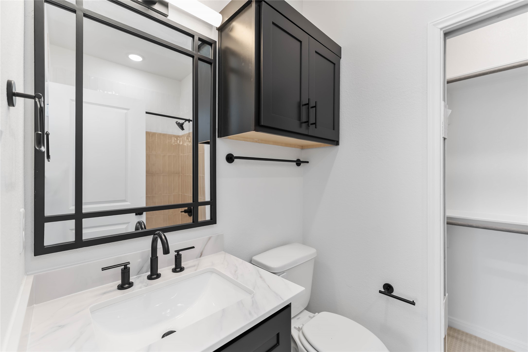 3508 Delhi Street Houston, TX 77022 - Photo 26 of 38 a bathroom with a sink toilet and mirror