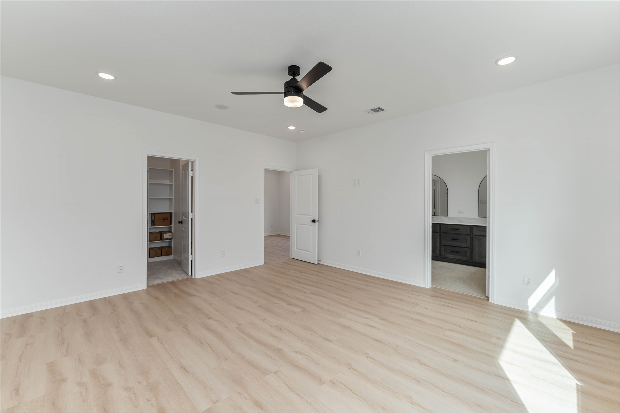 3508 Delhi Street Houston, TX 77022 - Photo 30 of 38 a view of an empty room with wooden floor and fan