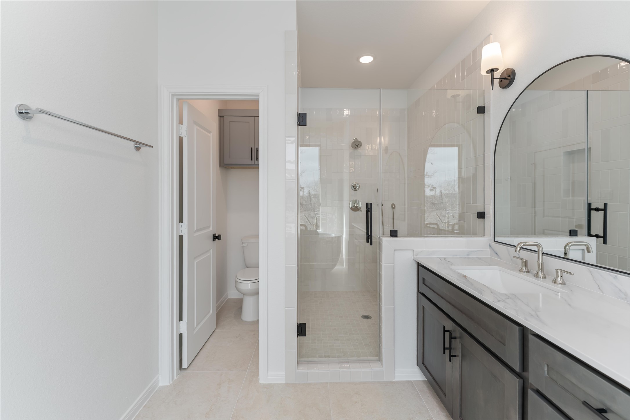 3508 Delhi Street Houston, TX 77022 - Photo 34 of 38 a spacious bathroom with a shower sink and mirror