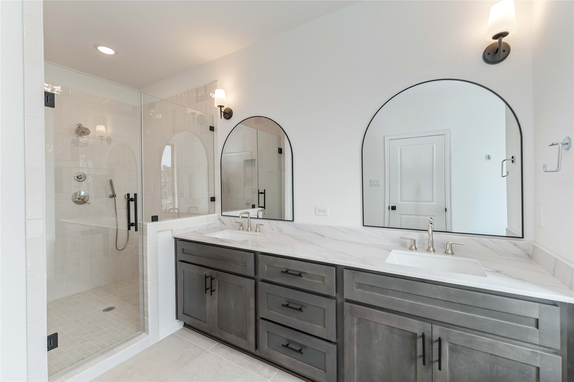 3508 Delhi Street Houston, TX 77022 - Photo 35 of 38 a bathroom with a double vanity sink mirror and shower