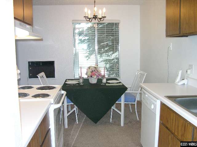 400 South Saliman Road, Unit 47 Carson City, NV 89701 - Photo 1 of 9 a view of a dining room with furniture window and outside view