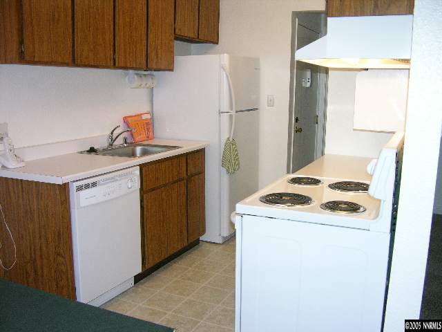 400 South Saliman Road, Unit 47 Carson City, NV 89701 - Photo 8 of 9 a kitchen with a stove and a refrigerator