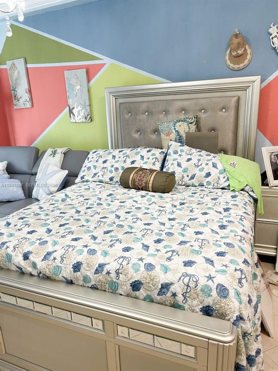 6345 Collins Avenue, Unit 435 Miami Beach, FL 33141 - Photo 28 of 28 a bedroom with a bed and a window