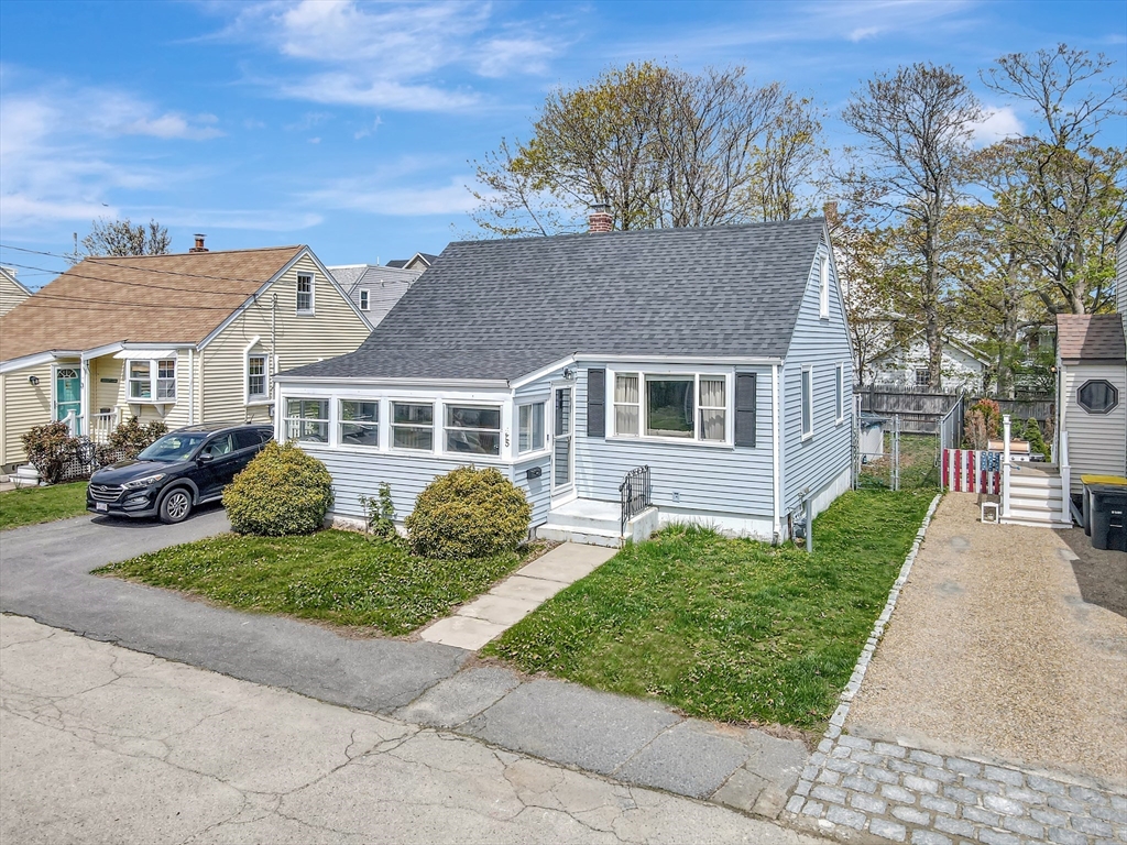 5 G Street Hull, MA 02045 - Photo 2 of 41 a front view of a house with garden and plants