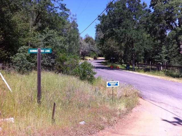 a view of a lake with a house in the background