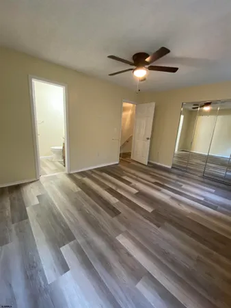 a bathroom with a double vanity sink toilet and a mirror