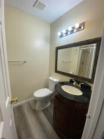 a bathroom with a glass shower door