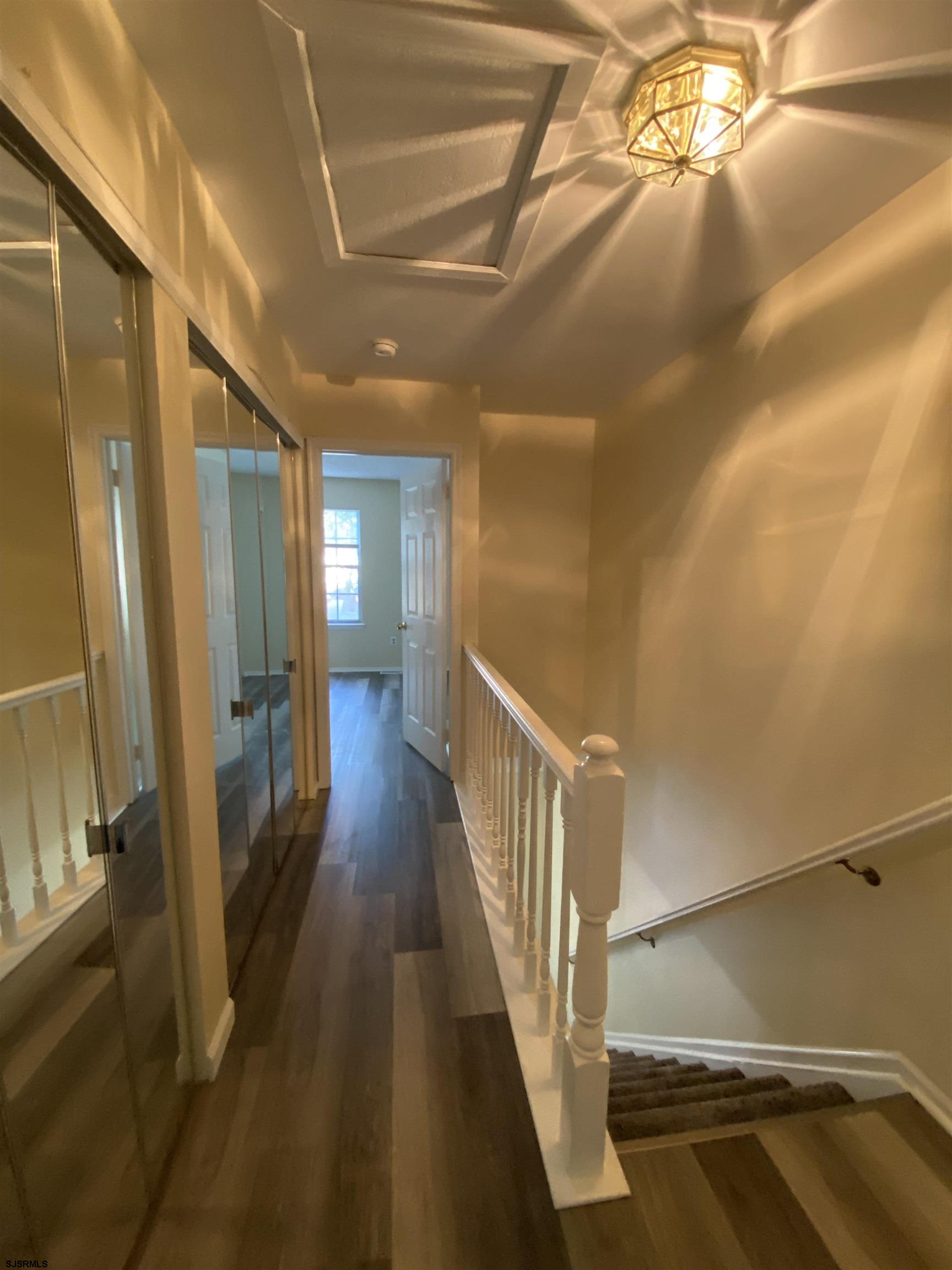 66 Shawnee Place, Unit 66 Galloway Township, NJ 08205 - Photo 15 of 20 a view of a hallway with wooden floor