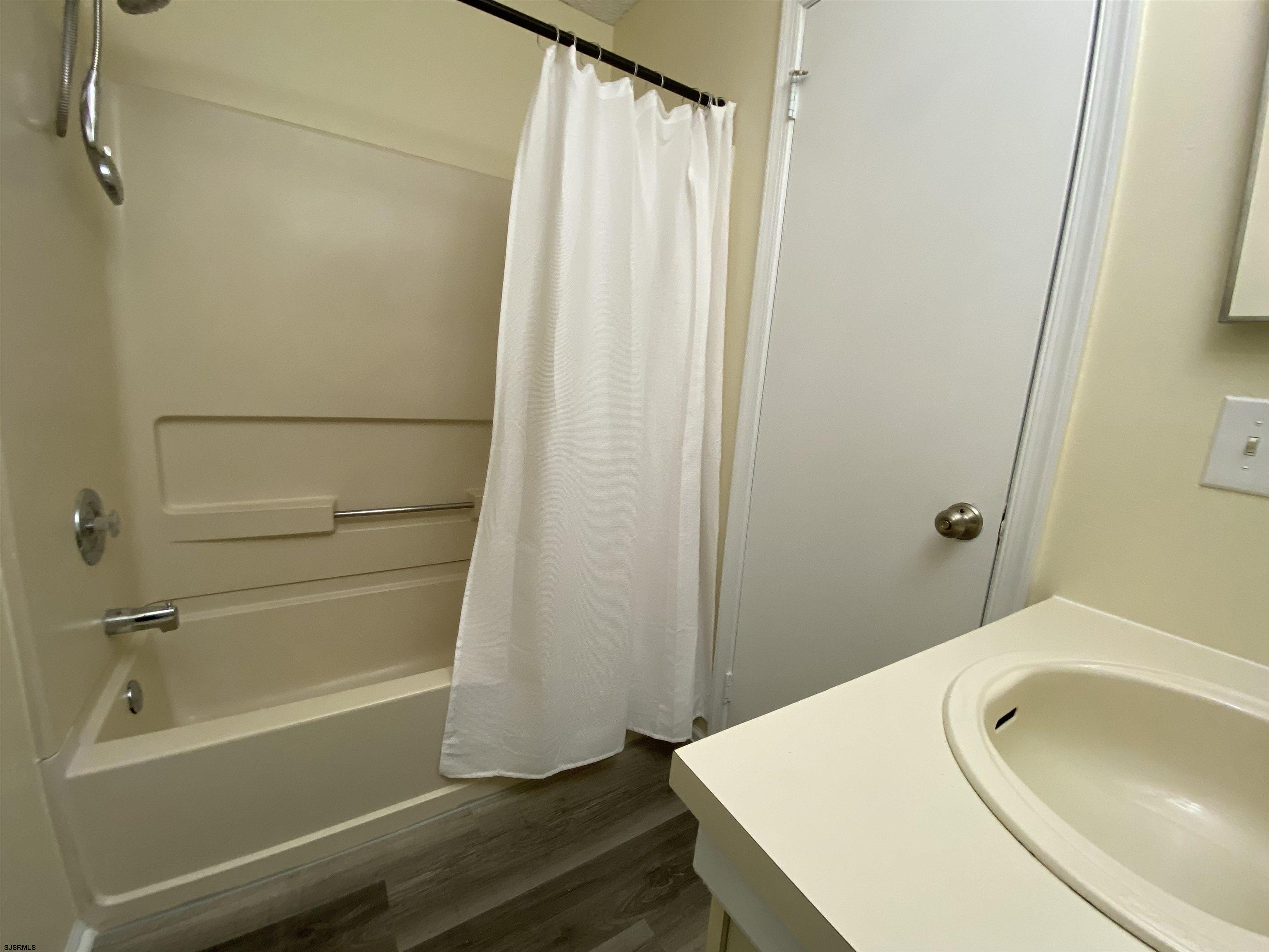66 Shawnee Place, Unit 66 Galloway Township, NJ 08205 - Photo 20 of 20 a bathroom with a tub and sink