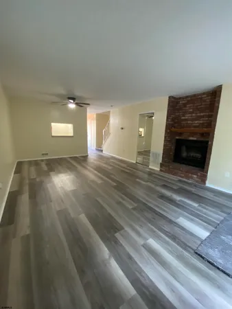 a view of a livingroom with wooden floor