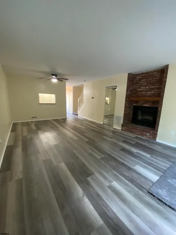 a view of a livingroom with wooden floor
