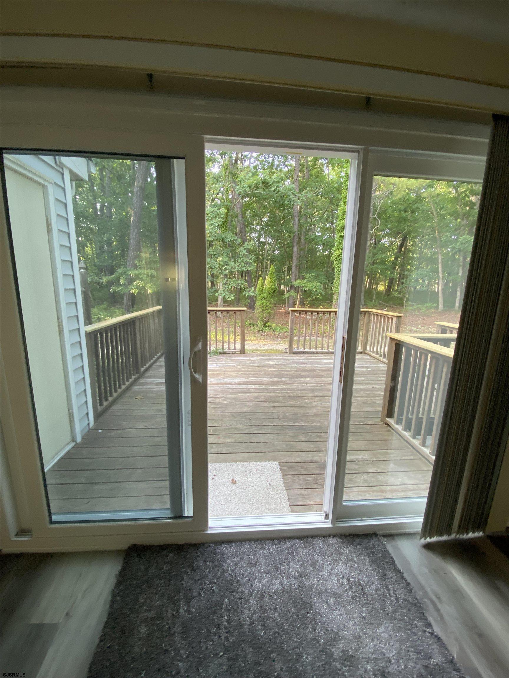 66 Shawnee Place, Unit 66 Galloway Township, NJ 08205 - Photo 6 of 20 a view of outdoor space with sliding door