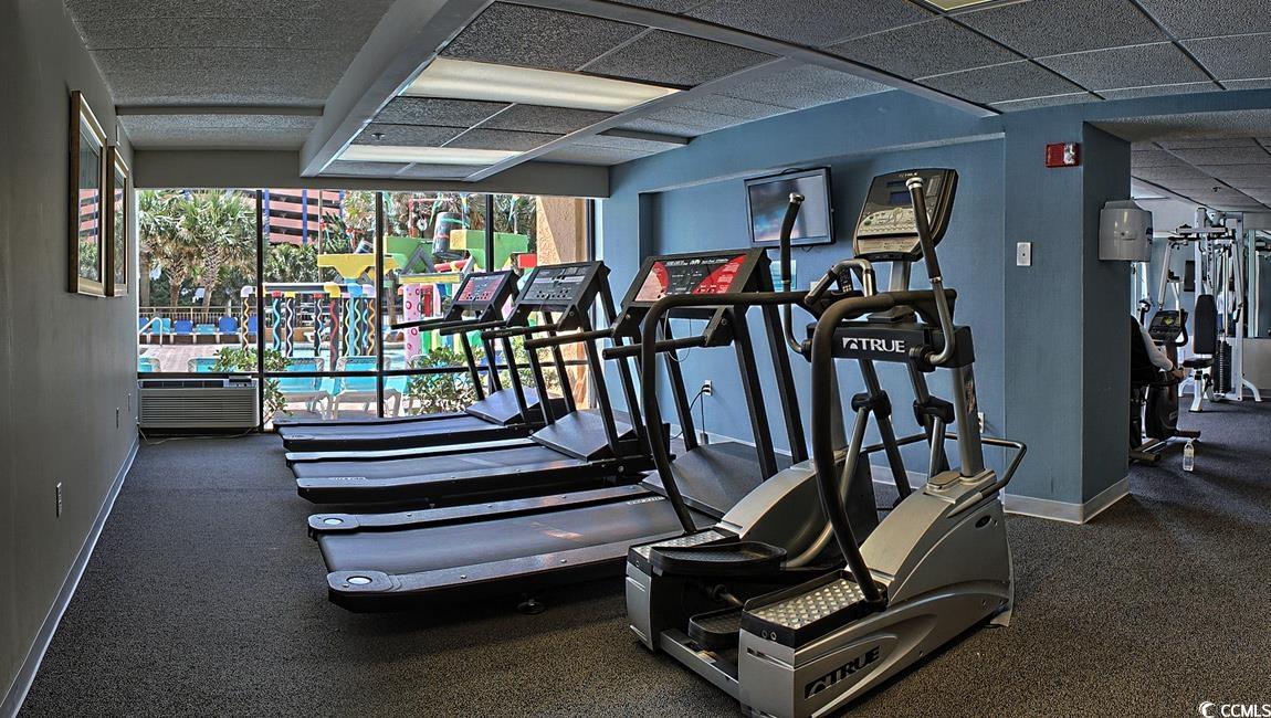 7000 North Ocean Boulevard, Unit 129 Myrtle Beach, SC 29572 - Photo 13 of 27 Gym with a paneled ceiling