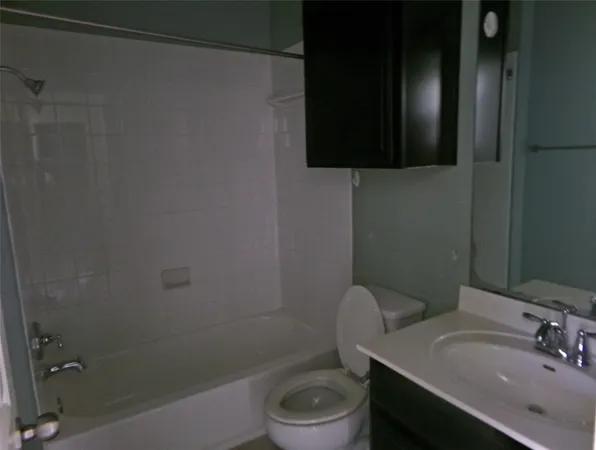 a bathroom with a sink toilet and vanity