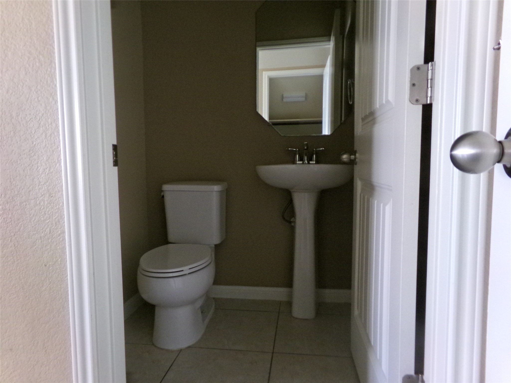 14001 Avery Ranch Boulevard, Unit 2103 Austin, TX 78717 - Photo 8 of 21 a bathroom with a toilet sink and mirror