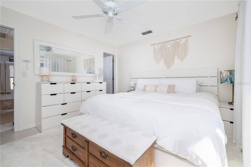 4786 South Atlantic Avenue, Unit B1 Ponce Inlet, FL 32127 - Photo 13 of 22 a bedroom with a bed and window