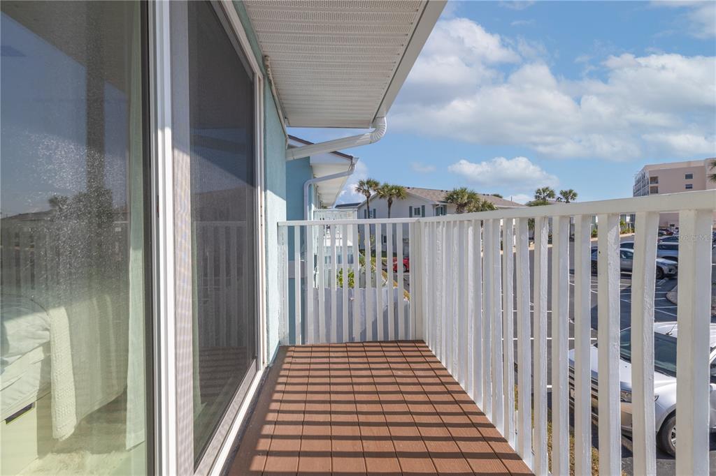 4786 South Atlantic Avenue, Unit B1 Ponce Inlet, FL 32127 - Photo 14 of 22 a view of a balcony with wooden floor