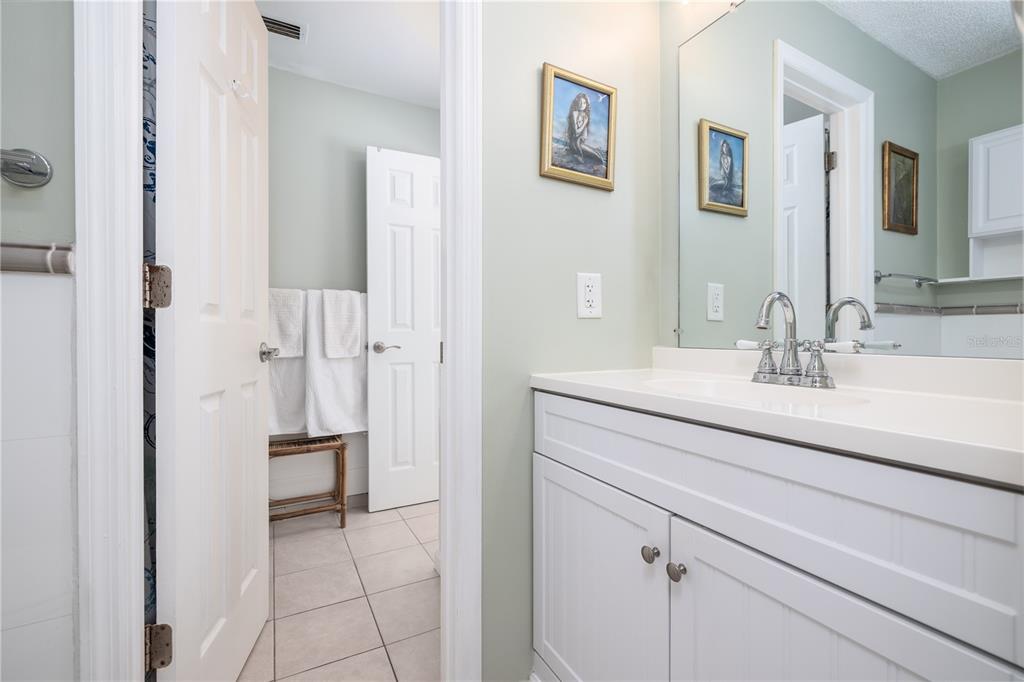 4786 South Atlantic Avenue, Unit B1 Ponce Inlet, FL 32127 - Photo 17 of 22 a bathroom with a sink double vanity and a mirror