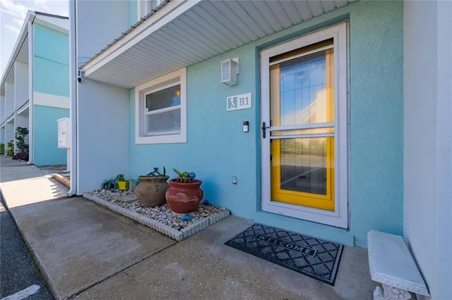 a living room with furniture and a lamp