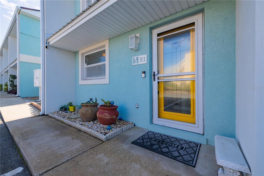 4786 South Atlantic Avenue, Unit B1 Ponce Inlet, FL 32127 - Photo 4 of 22 a living room with baby crib furniture and a window