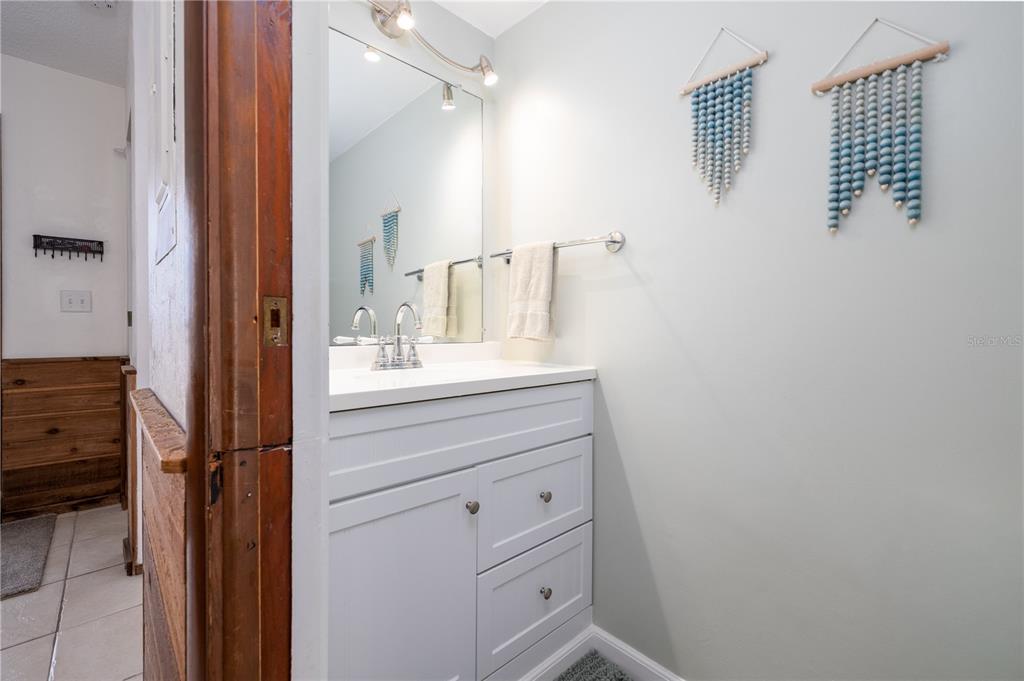 4786 South Atlantic Avenue, Unit B1 Ponce Inlet, FL 32127 - Photo 9 of 22 a bathroom with a sink and a mirror