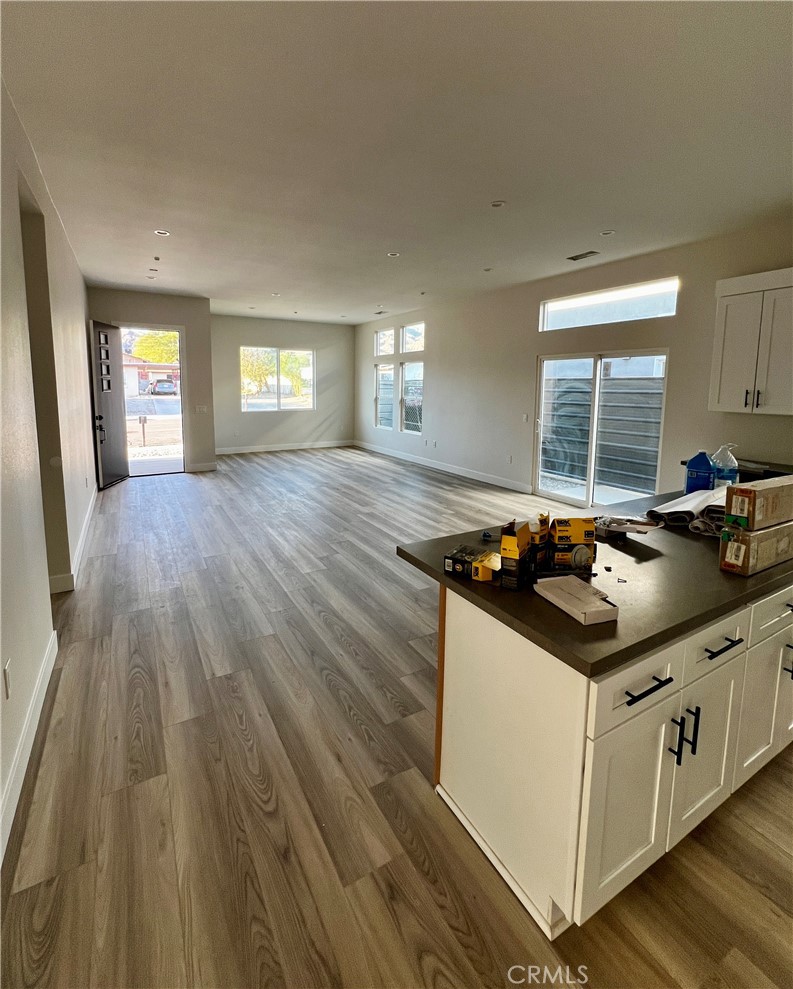 66231 3rd Street Desert Hot Springs, CA 92240 - Photo 4 of 13 a kitchen with granite countertop a stove and a sink