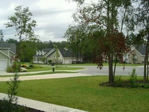 a aerial view of a house with a yard