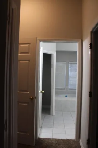 a bathroom with a granite countertop toilet a sink and a mirror
