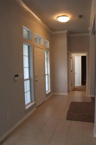 a kitchen with a stove cabinets and wooden floor