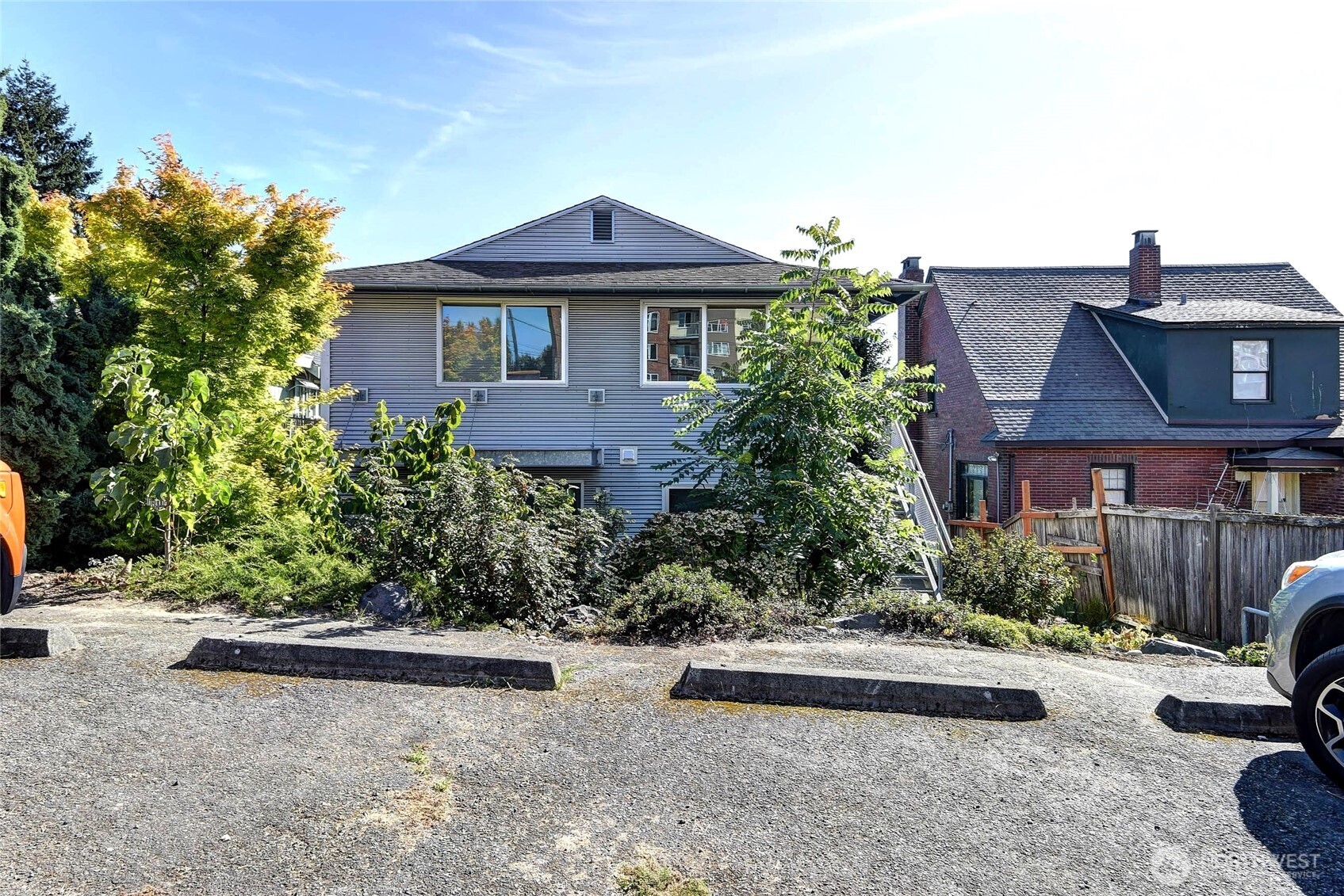 1822 South King Street, Unit AD Seattle, WA 98144 - Photo 4 of 11 front view of a house with a yard