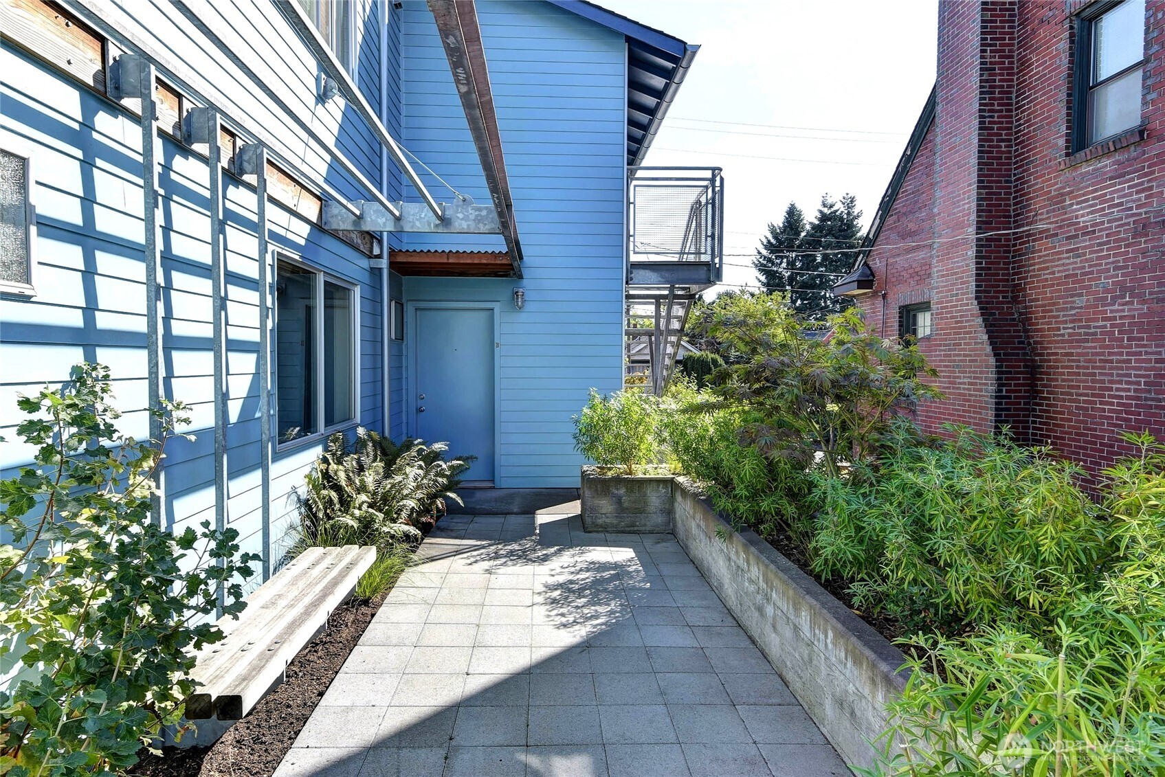 1822 South King Street, Unit AD Seattle, WA 98144 - Photo 5 of 11 a view of a house with potted plants