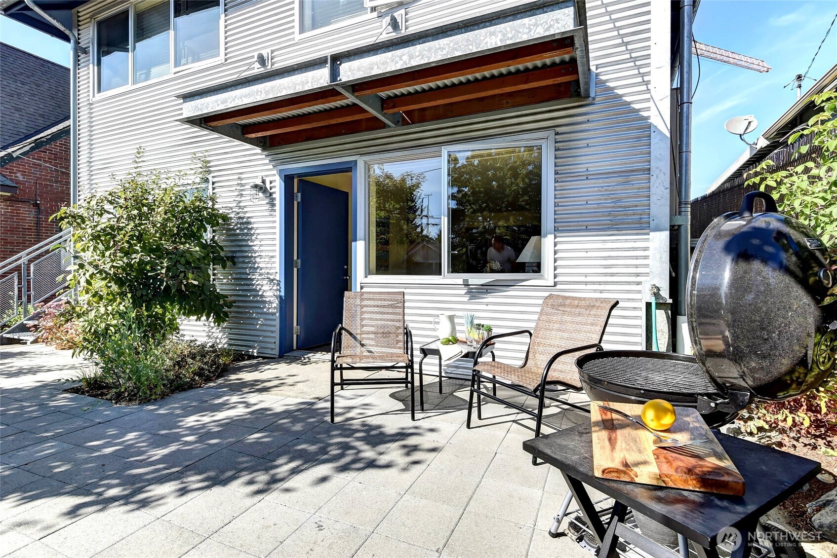 1822 South King Street, Unit AD Seattle, WA 98144 - Photo 6 of 11 a view of a dinning tables and chairs in the patio