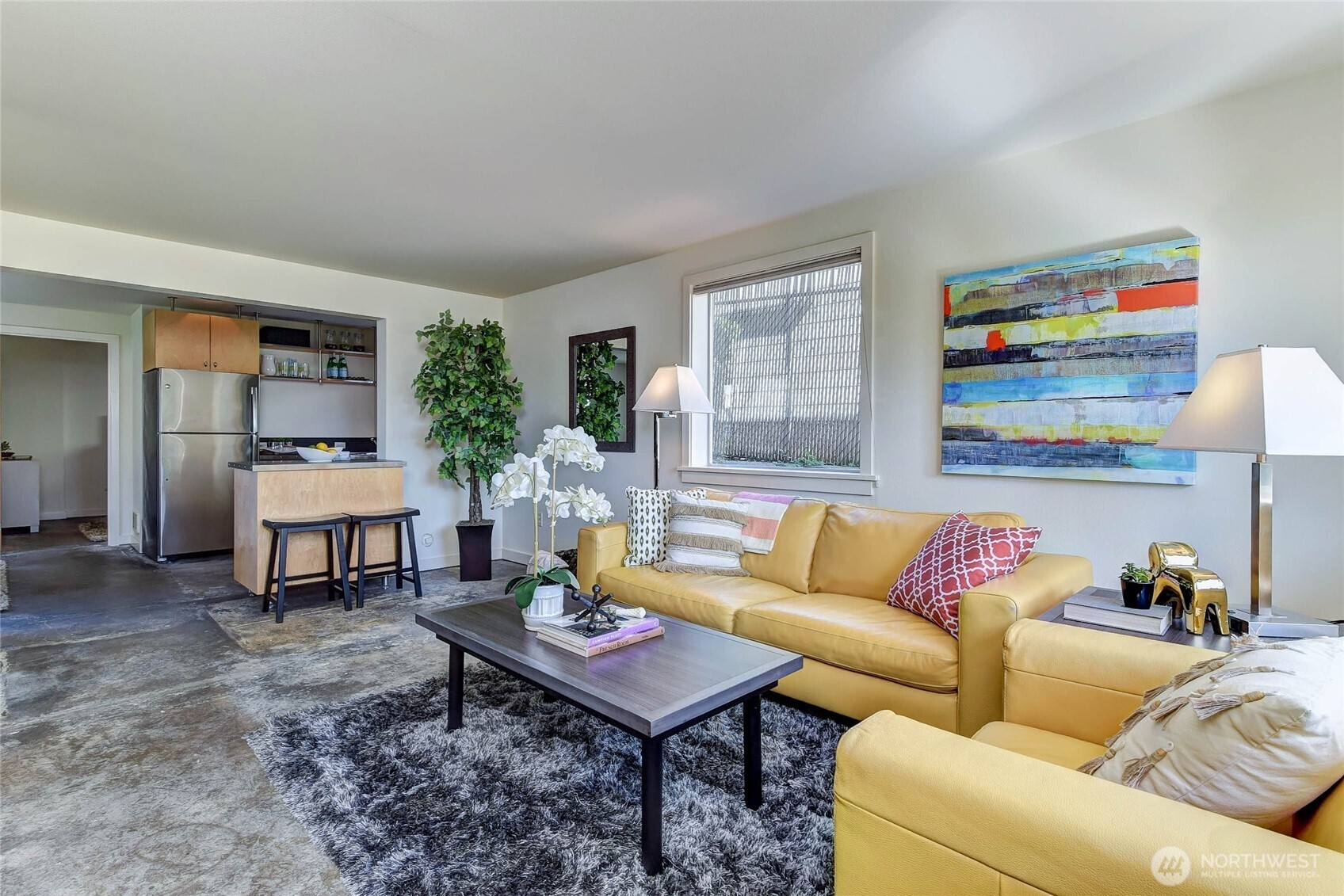 1822 South King Street, Unit AD Seattle, WA 98144 - Photo 7 of 11 a living room with furniture and a rug
