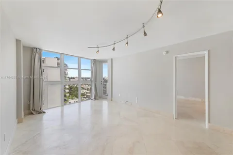 a view of an empty room with a window