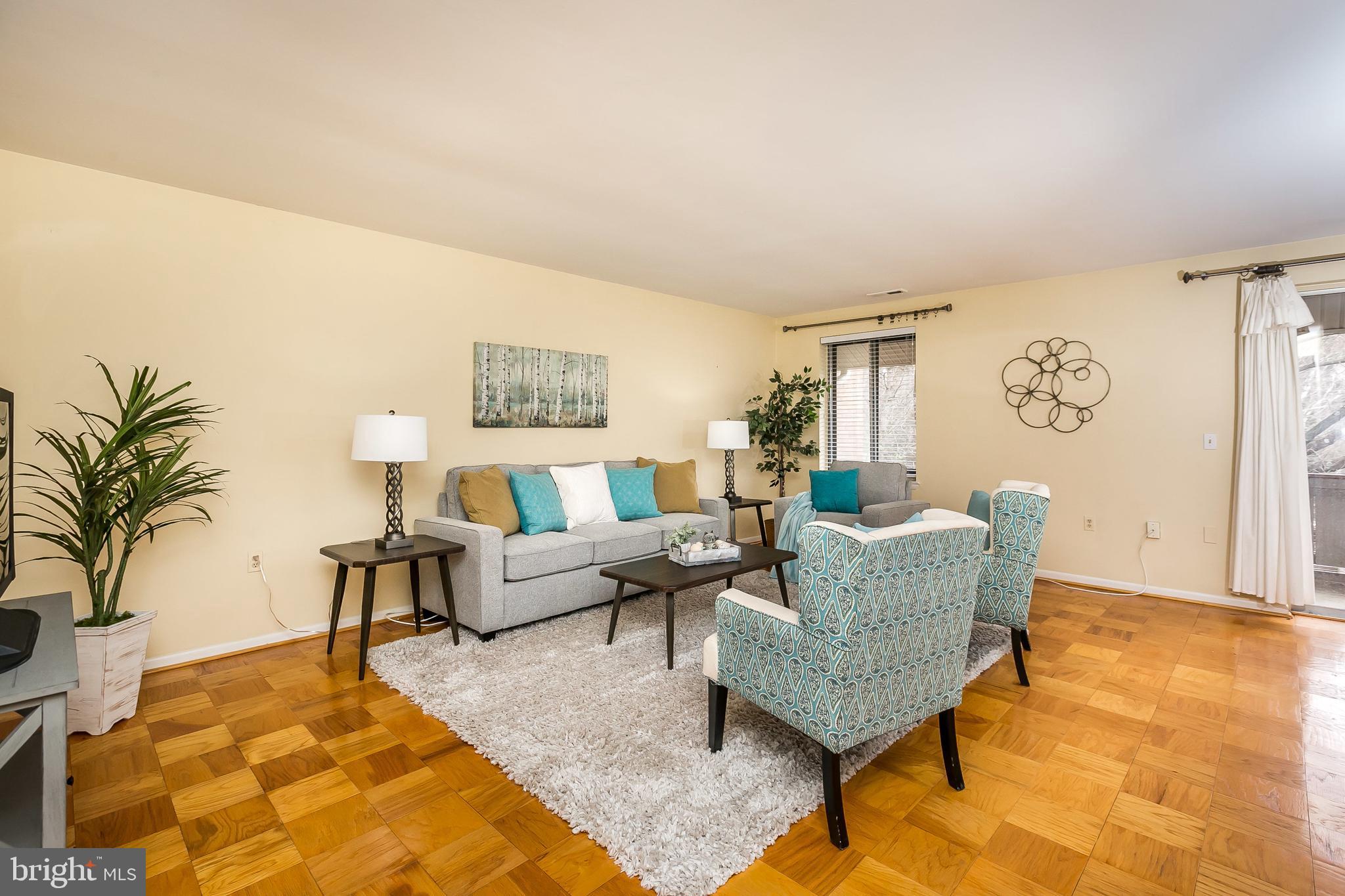 114 Cross Keys Road, Unit R114E Baltimore, MD 21210 - Photo 3 of 33 a living room with furniture and a rug