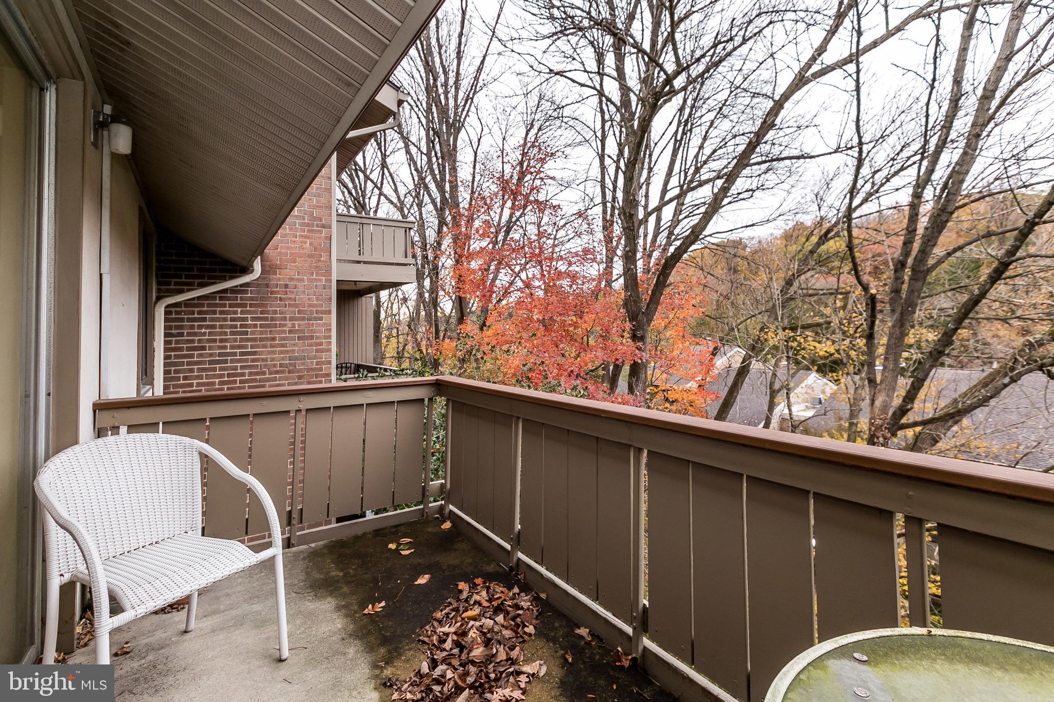114 Cross Keys Road, Unit R114E Baltimore, MD 21210 - Photo 29 of 33 a backyard of a house with table and chairs