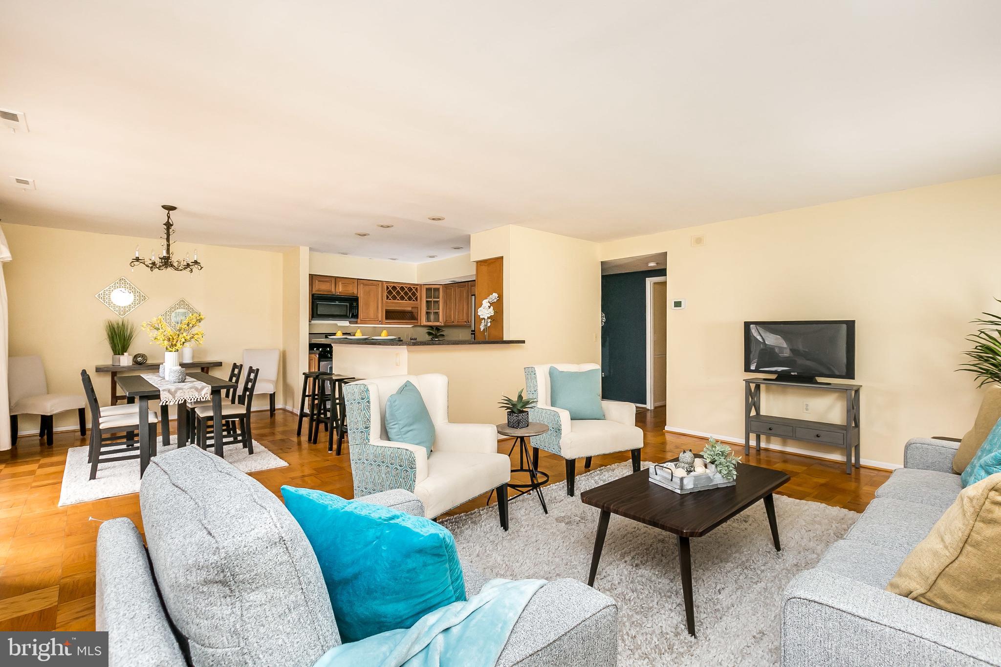 114 Cross Keys Road, Unit R114E Baltimore, MD 21210 - Photo 7 of 33 a living room with furniture and a view of kitchen