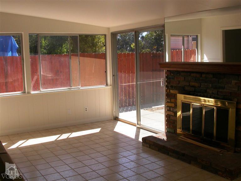 7248 Arthur Rondo Ventura, CA 93003 - Photo 11 of 28 a view of an empty room with wooden floor and a fireplace