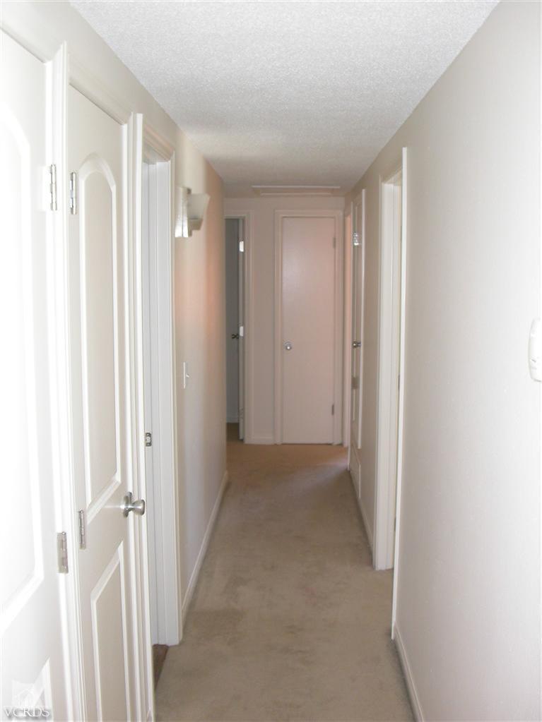 7248 Arthur Rondo Ventura, CA 93003 - Photo 12 of 28 a view of a hallway with wooden floor