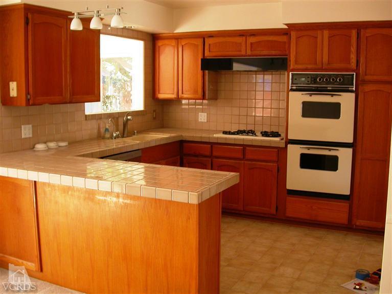 7248 Arthur Rondo Ventura, CA 93003 - Photo 6 of 28 a kitchen with stainless steel appliances granite countertop a stove a sink and a microwave